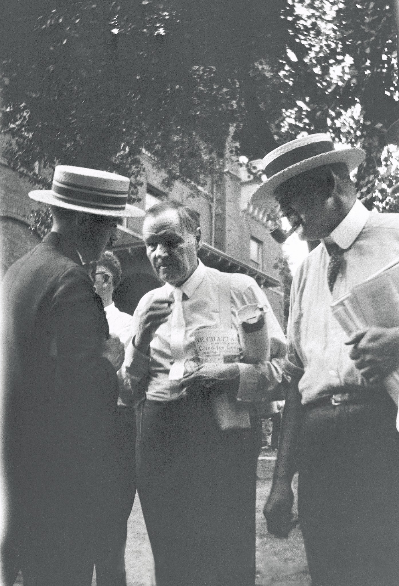 Clarence Darrow speaking with men in Dayton during the 1925 Scopes Trial